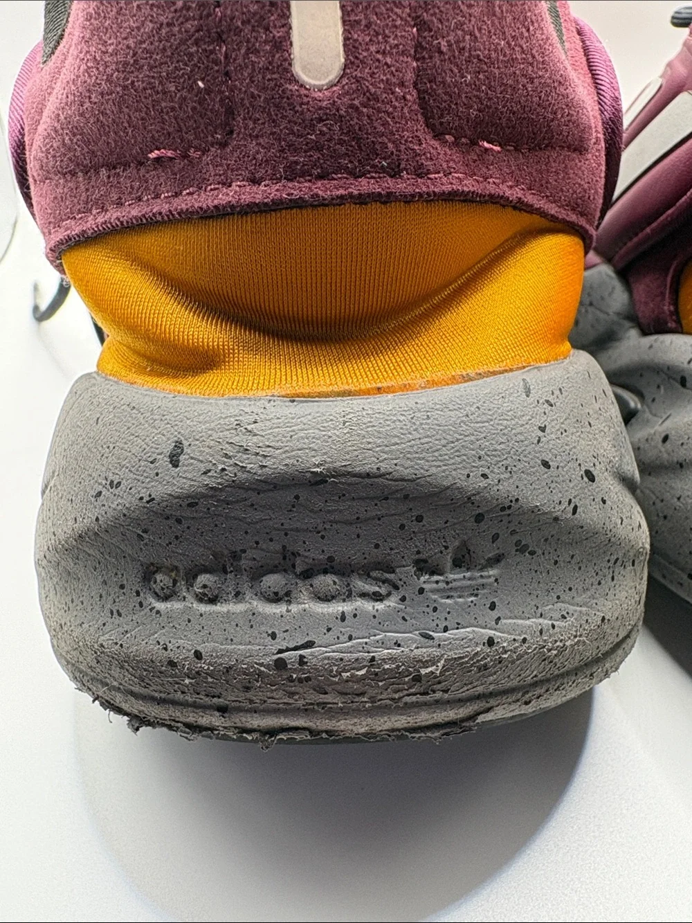 adidas OZELIA Men’s Burgundy and Black Running Sneaker with Yellow Accents